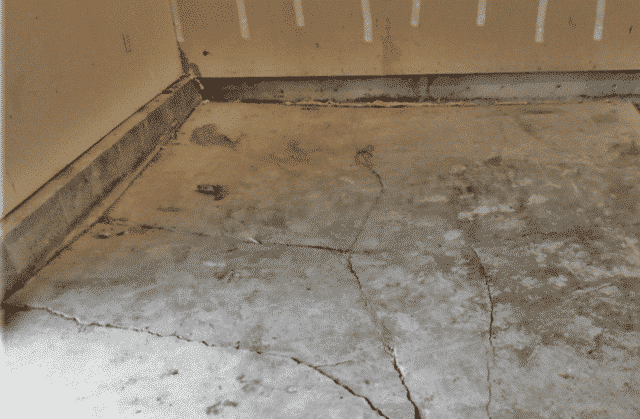 Lifting and Sealing a Concrete Garage Slab in a Missoula Home - Before Photo