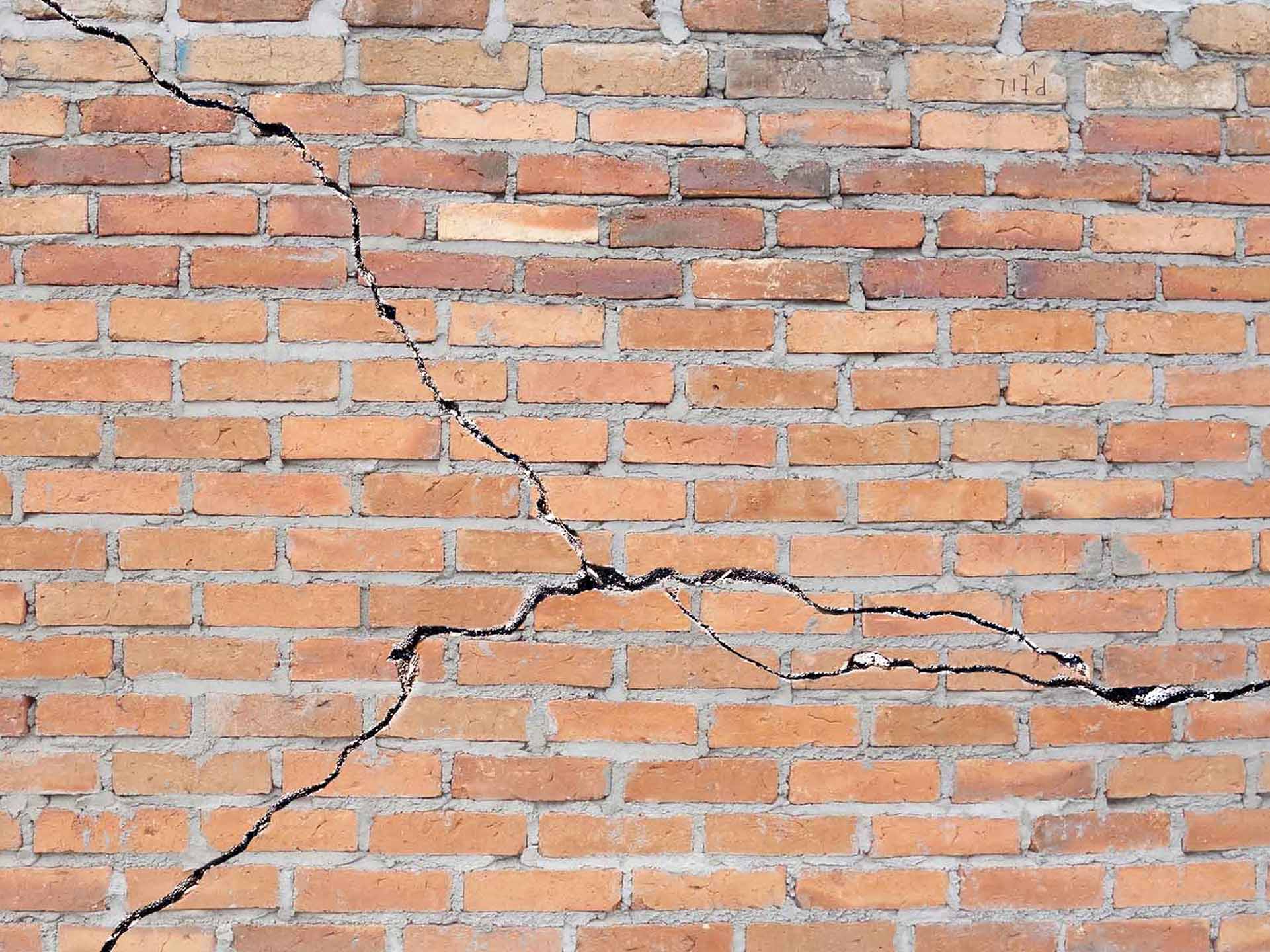 spiderweb cracks in brick